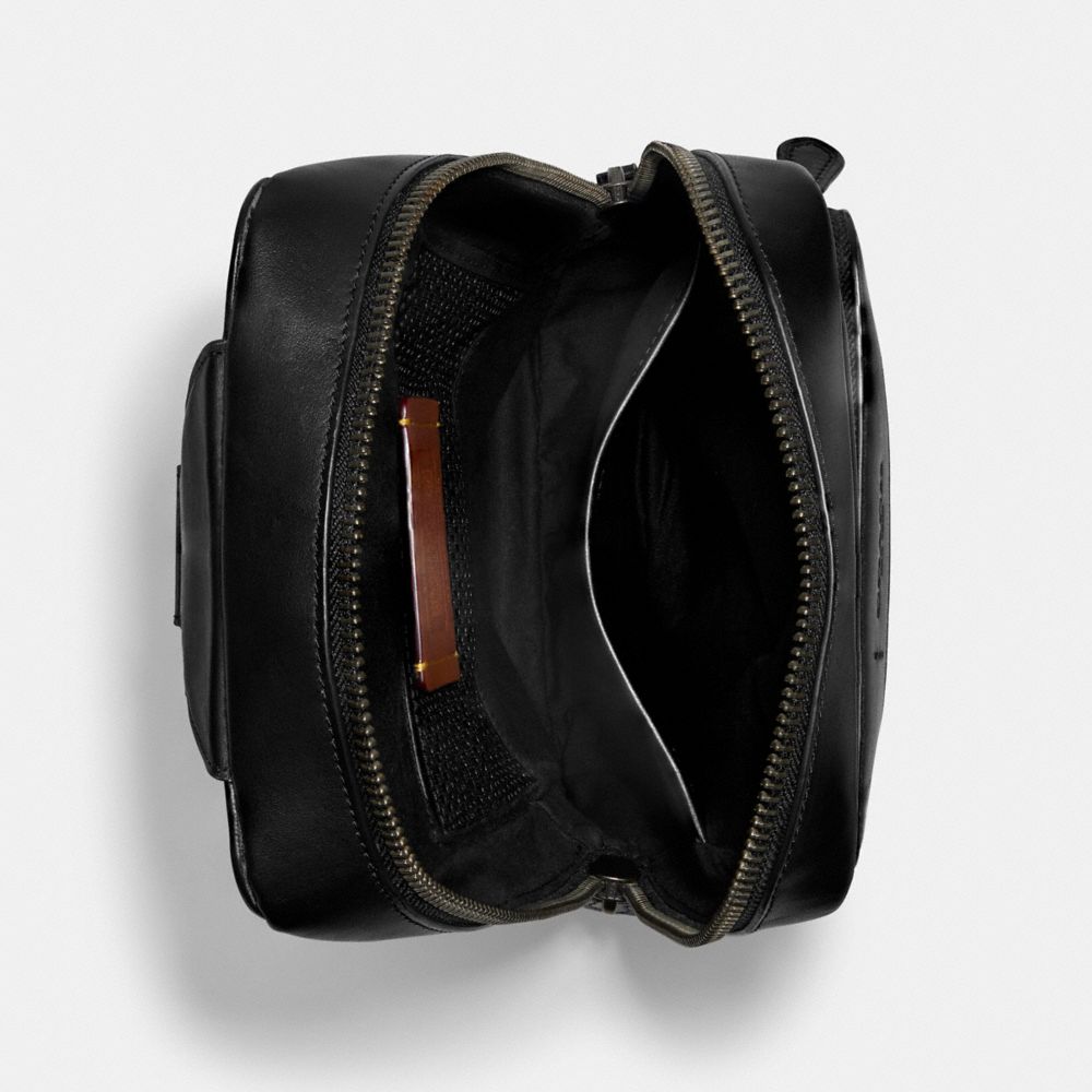 Coach Gotham Pack In Signature Canvas Signature Coated Canvas/Smooth Leather/Black Copper/Charcoal/Bla | COH866584