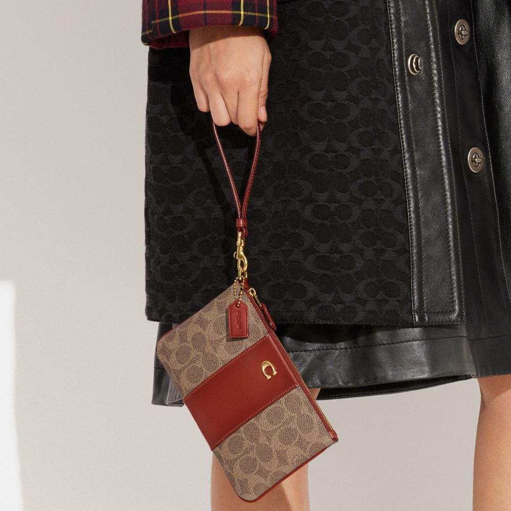 Coach Small Wristlet In Signature Canvas Coated Canvas/Brass/Tan/Rust | COH865645
